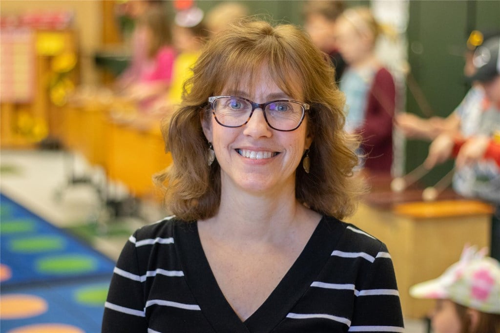 A portrait photo of Lori Nelson in her classroom.