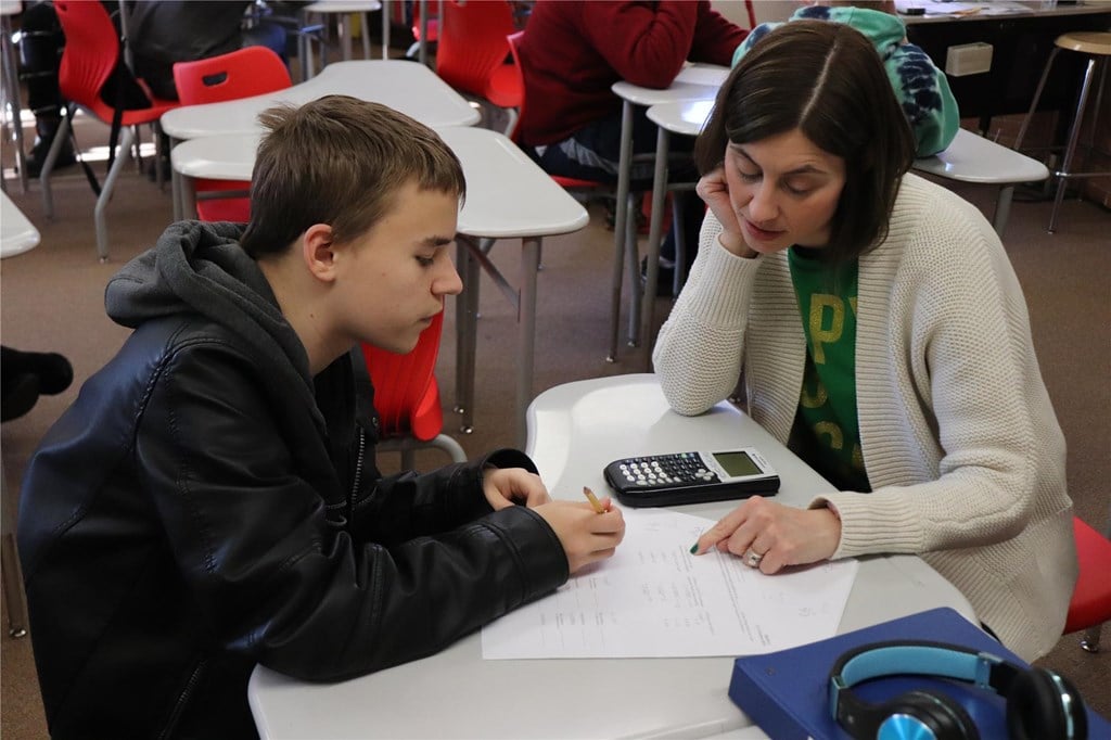 A teacher helping a student with math