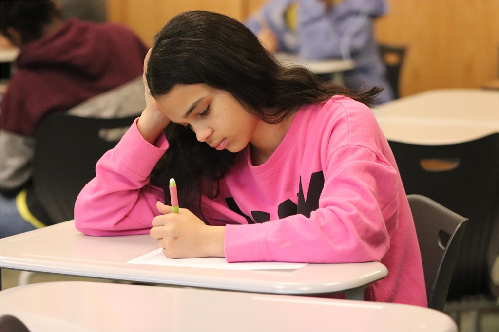 Student works on a math test.