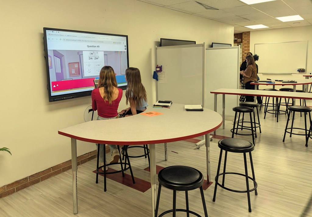 people looking at a tv