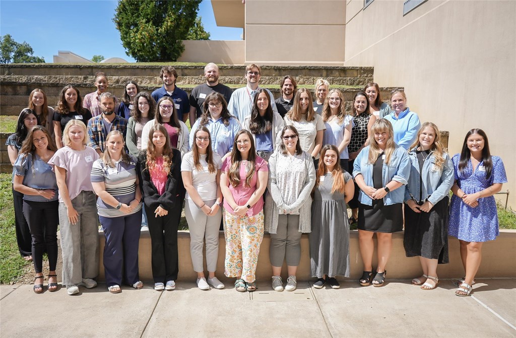 Members of the 2025-2026 induction class stand for a group photo.