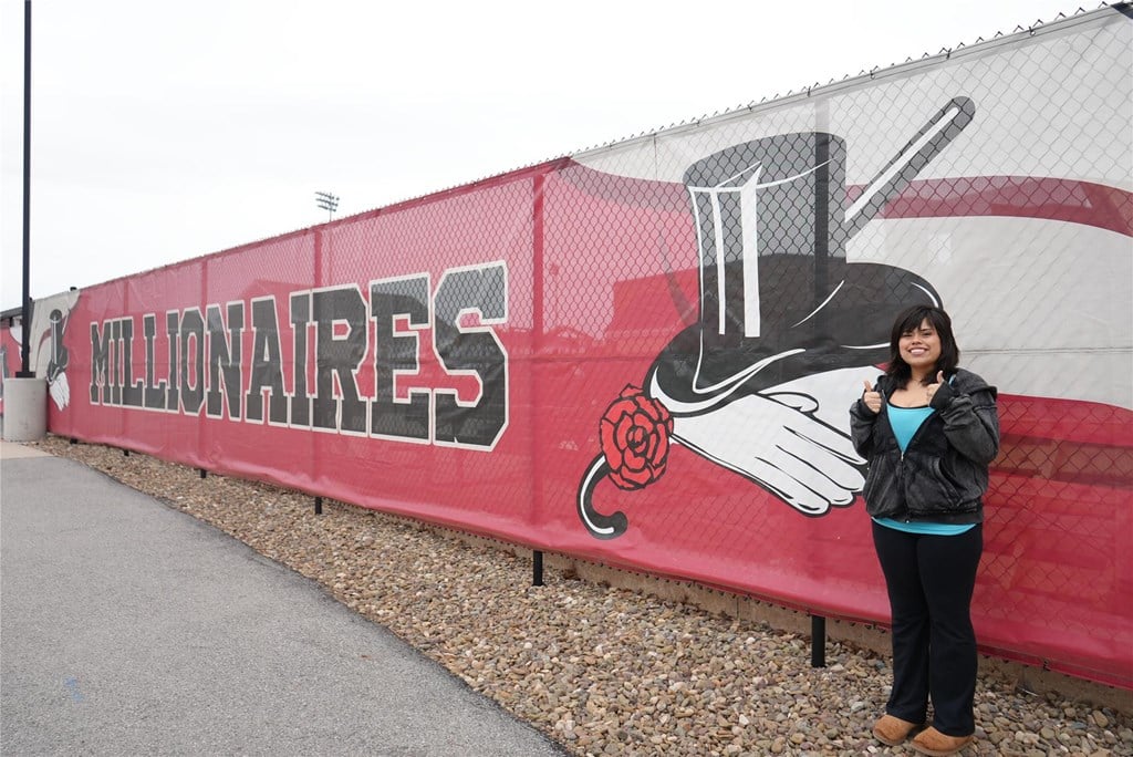 Student, Julianna Lynch 26', posing in front of her class project. 