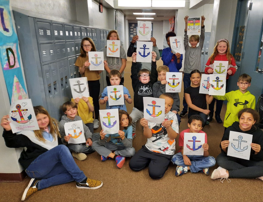 Students hold their 'anchors' for a picture.