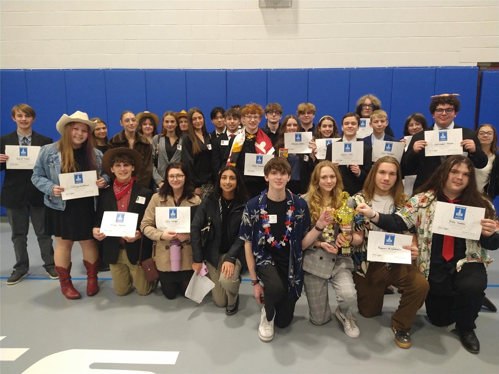 A group of students at ConCon with their certificates.