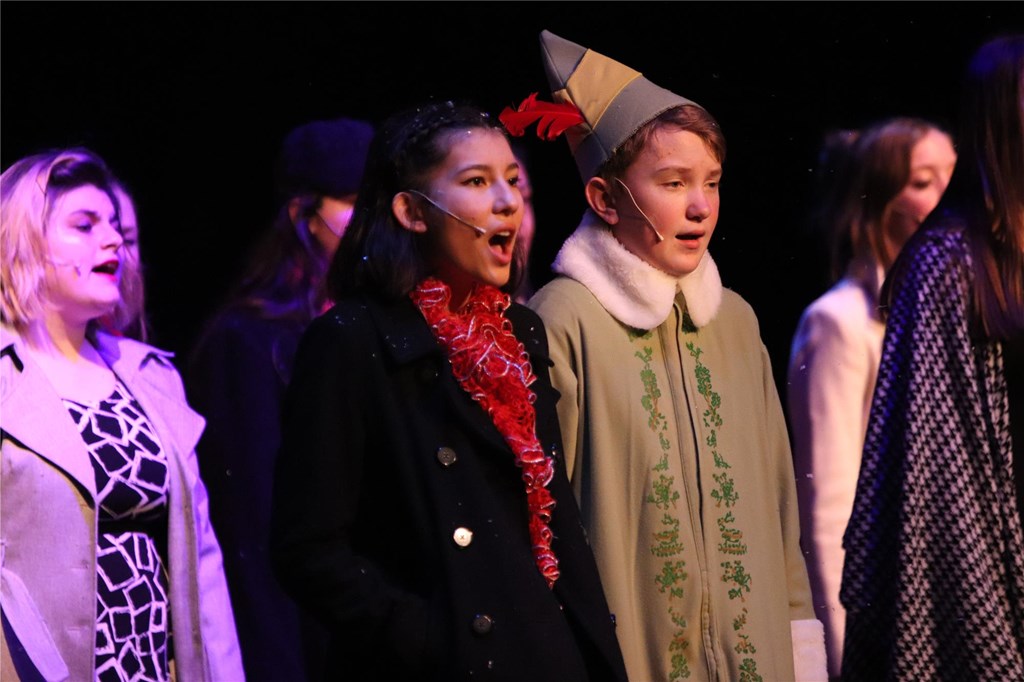 Students sing during school musical.