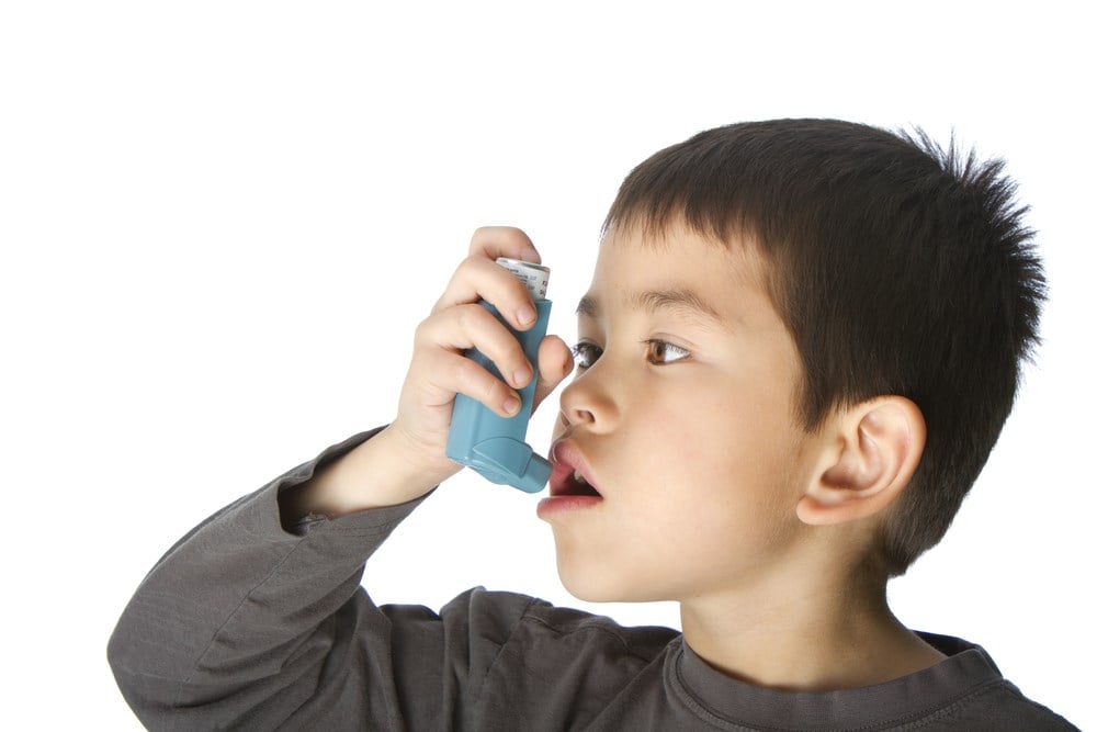Student uses an inhaler.